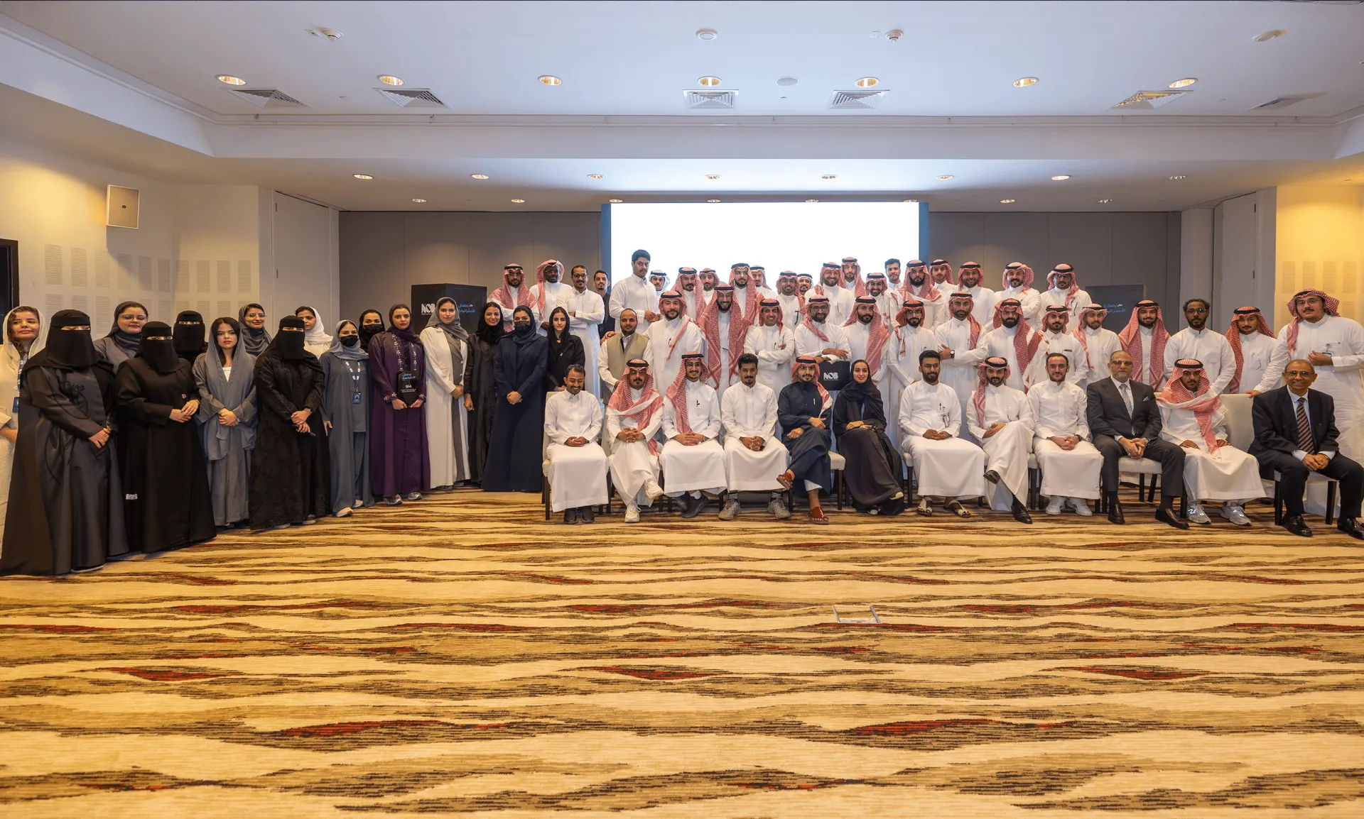 A large group photo of the NOB team